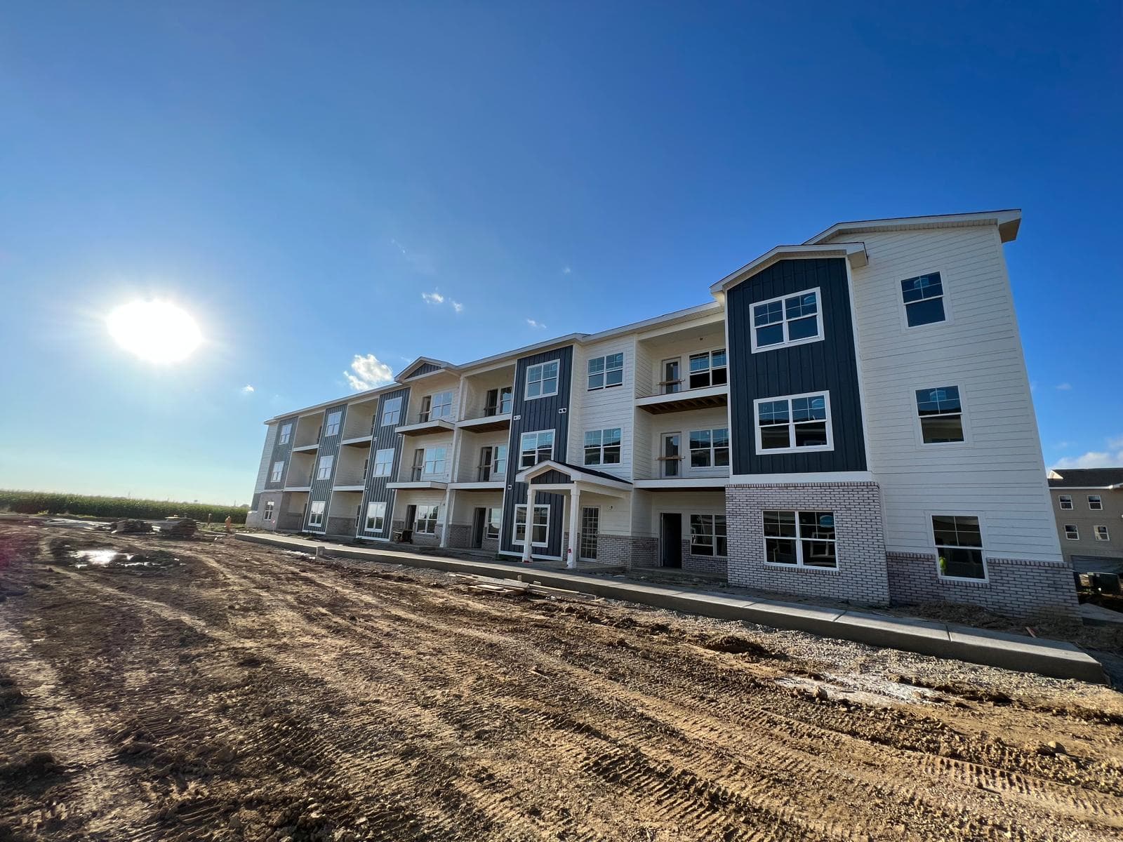 New apartment building exterior — siding and brick finish